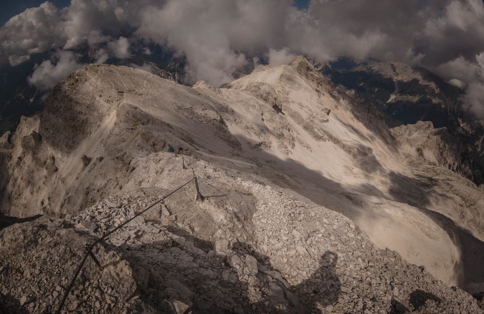 Stunning view of a rocky mountain range under dramatic cloud cover.